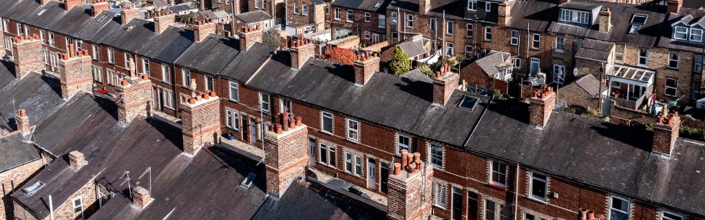 Aerial,View,Of,Old,Terraced,Houses,On,Back,To,Back Aerial view of old terraced houses on back to back streets in the suburbs of a large UK city in the North of England